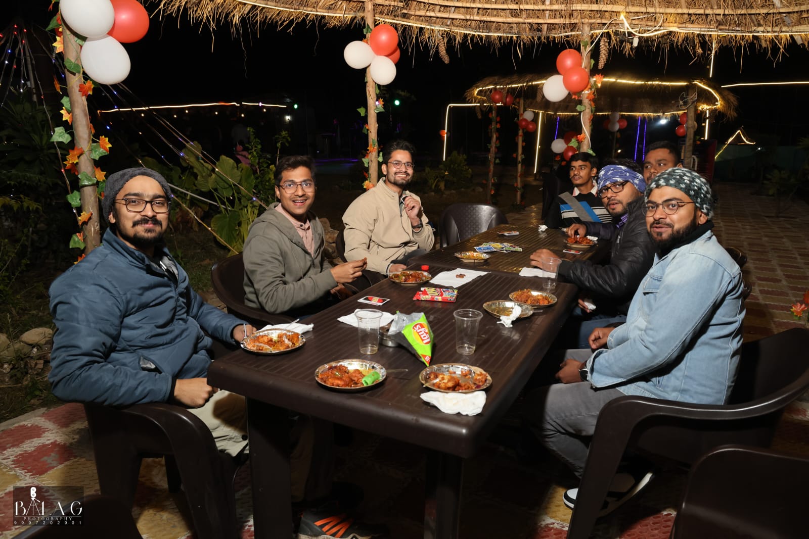 Group of friends enjoying drinks and snacks during a party at The Jungle Mist Café