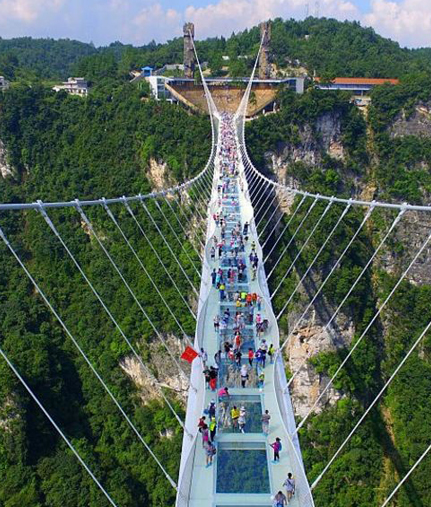 Traditional suspension bridge over Maa Ganga river in Rishikesh with mountain backdrop