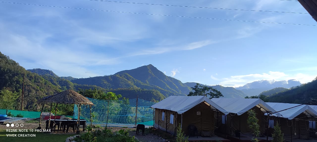 Scenic mountain valley view from Swiss cottage tent at The Jungle Mist Resort Rishikesh
